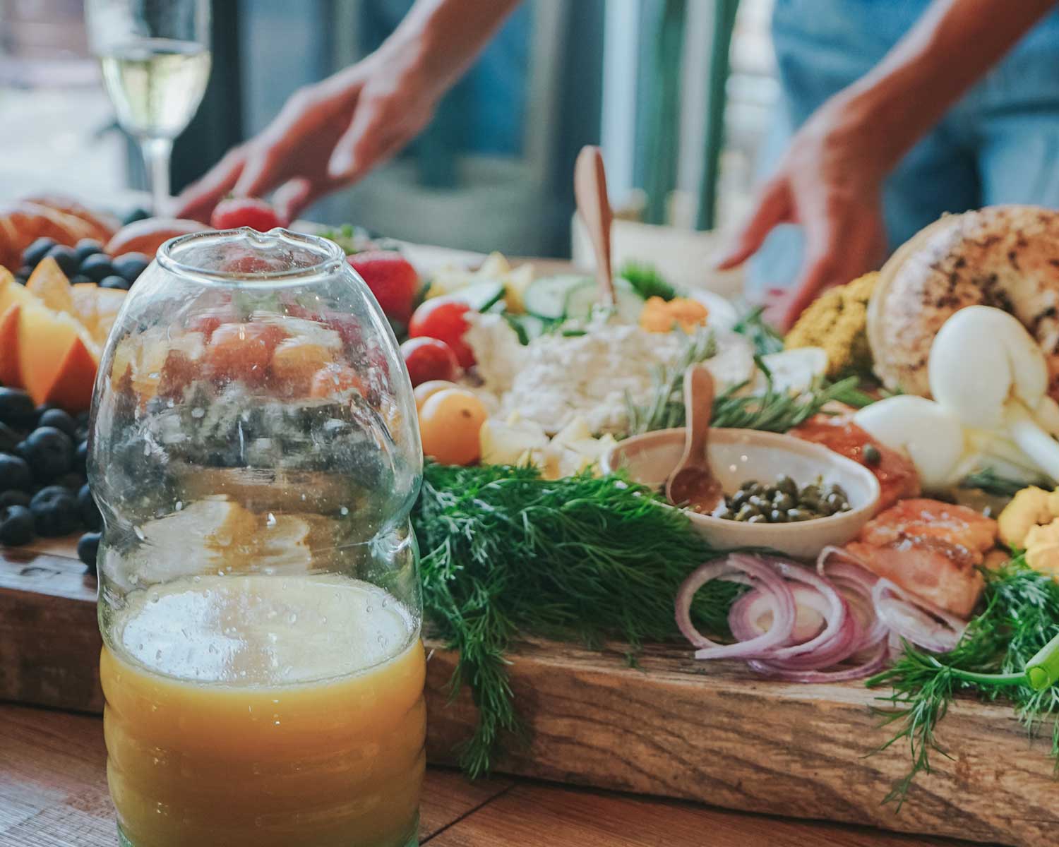 Plated meal with a glass of orange juice on a wooden table